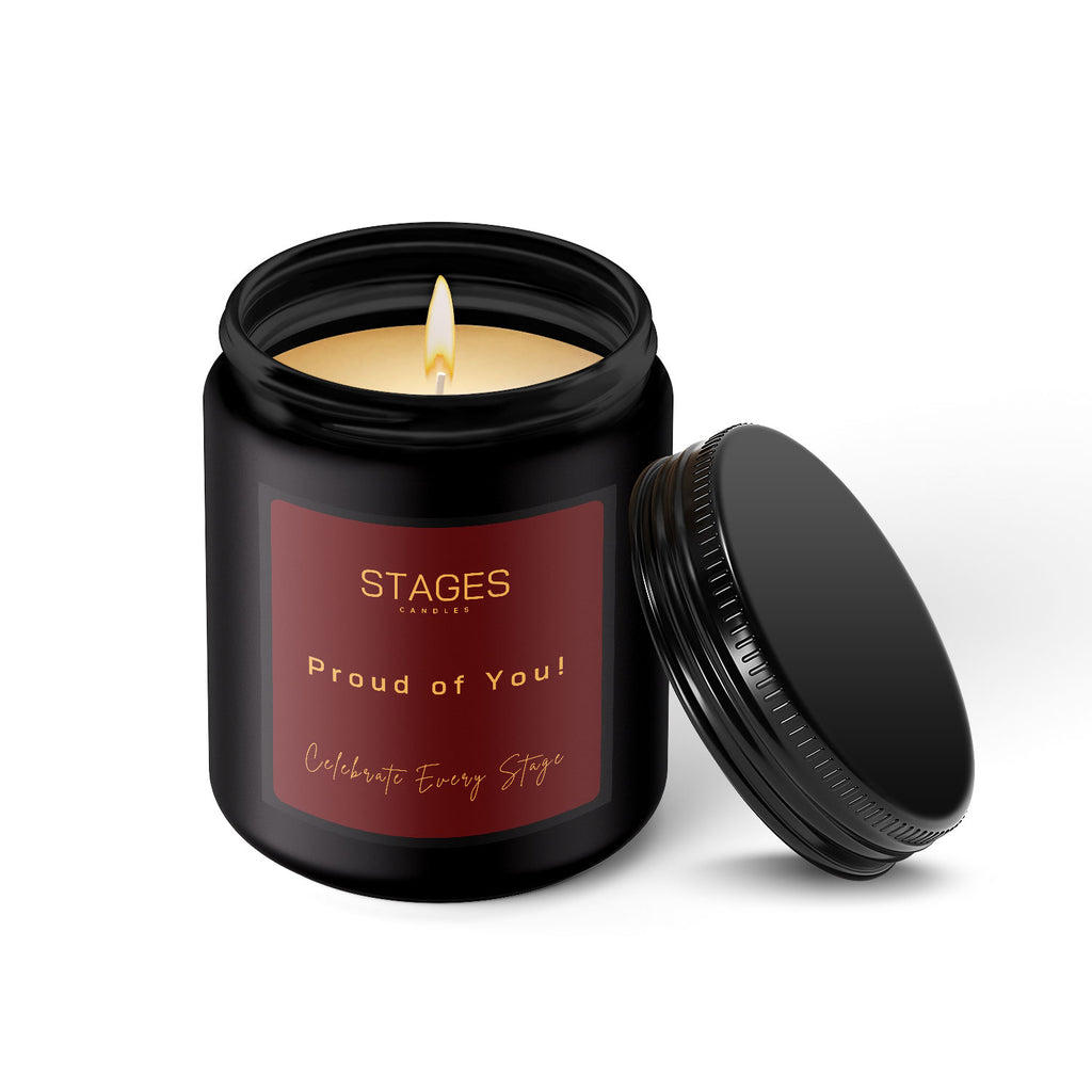 Scented candle in a black jar with a red label and Proud of You text as a gift.